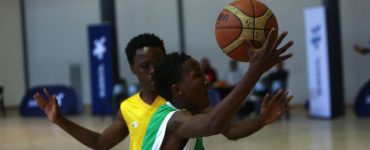 A player dribbles basketball at the Sasol NWU Junior tournament