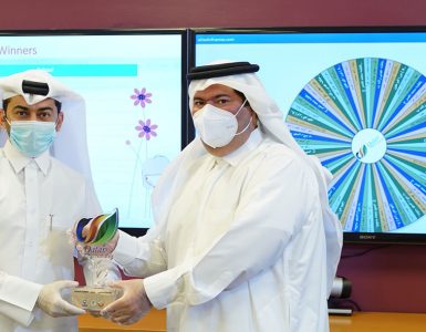 FEC Representative offering Qatar eNature Trophy to the Minister of Education